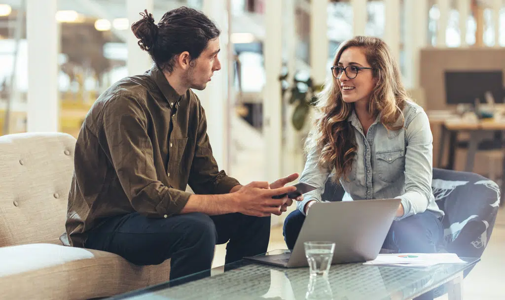 Image of two people discussing call tracking metrics.