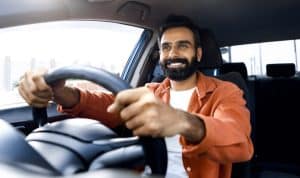 Man driving a car.