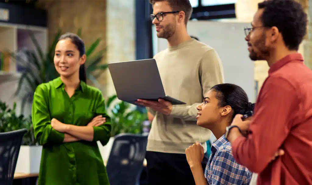 Four people in a meeting.