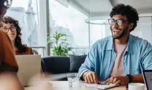 Man and woman at a desk discussing call tracking statistics.