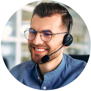 Man wearing a headset talking to a person on the phone.