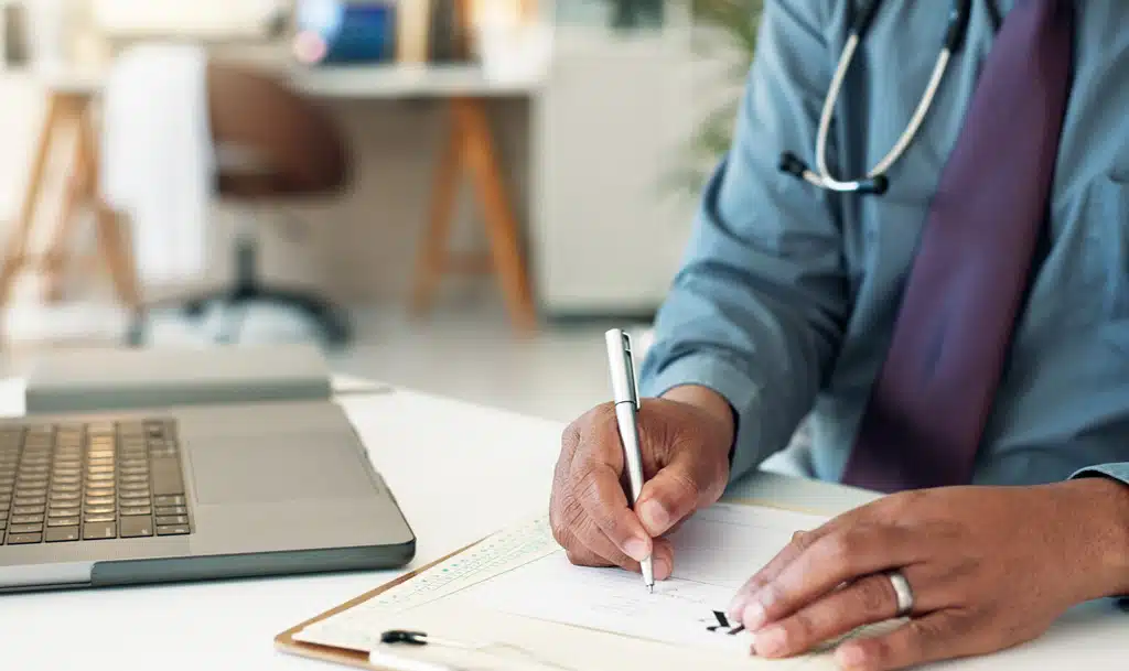 Doctor writing a healthcare content marketing strategy.