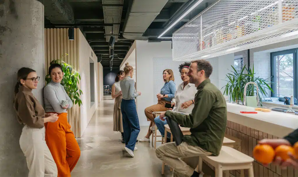 Picture of team members talking in an office kitchen